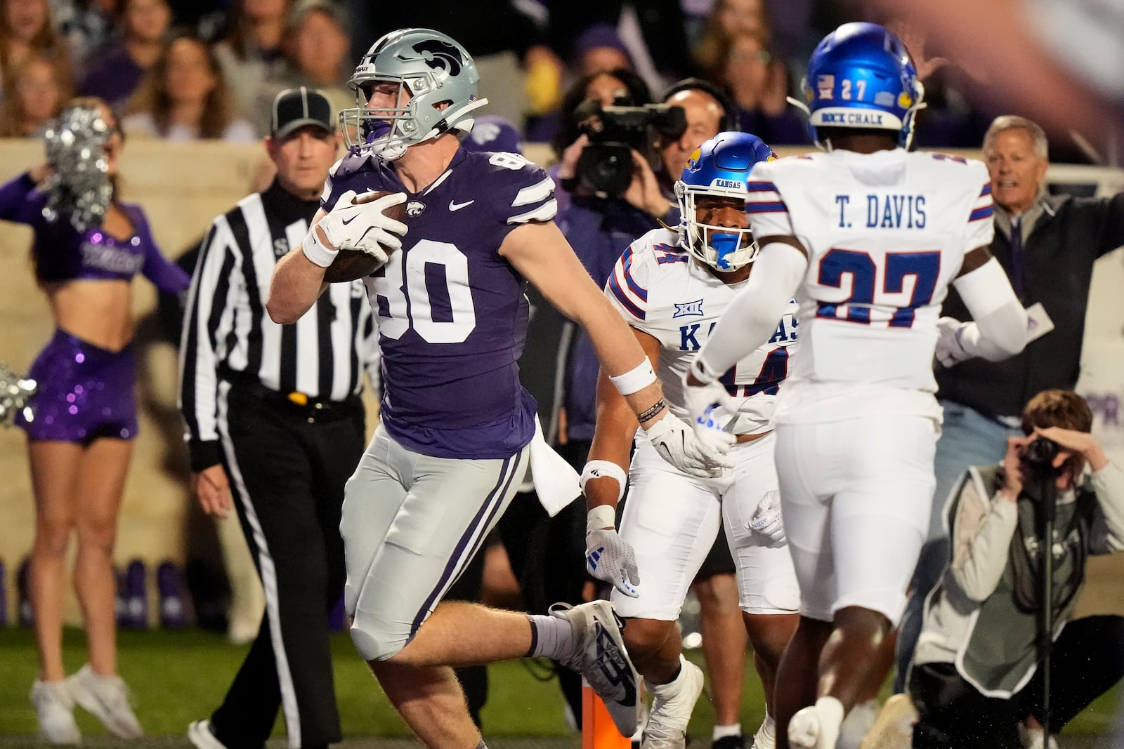 Kansas State tight end Will Anciaux (80) runs into the end zone to score a touchdown during the first half of an NCAA college football game against Kansas Saturday, Oct. 26, 2024, in Manhattan, Kan. (AP Photo/Charlie Riedel)