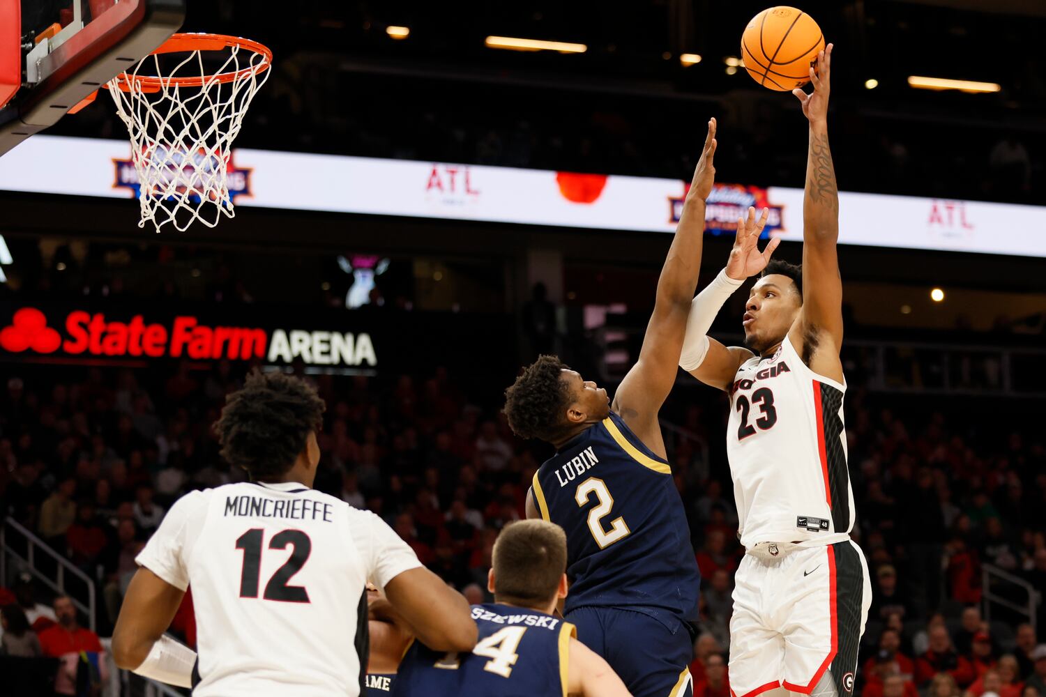 Bulldogs center Braelen Bridges goes up for a shot against Fighting Irish forward Ven-Allen Lubin during the second half Sunday night at State Farm Arena. (Miguel Martinez / miguel.martinezjimenez@ajc.com)