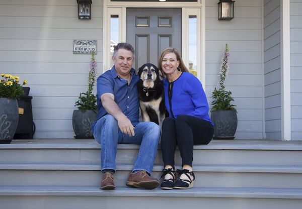 Brad Doss, national accounts manager at Recorded Books/RBmedia, and wife Brigette, a senior director of events at business event management firm PRA Atlanta, both said the front porch on the Kirkwood home was a selling point. They enjoy sitting outside to people-watch or visit with friends and their dog, Nixon, 13. Text by Grace Donnelly/Fast Copy News Service. Photo by Reann Huber/Fast Copy News Service.