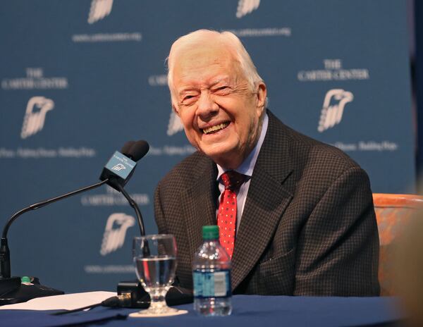 Former President Jimmy Carter shares in a light moment at the Carter Center in Atlanta in 2015.