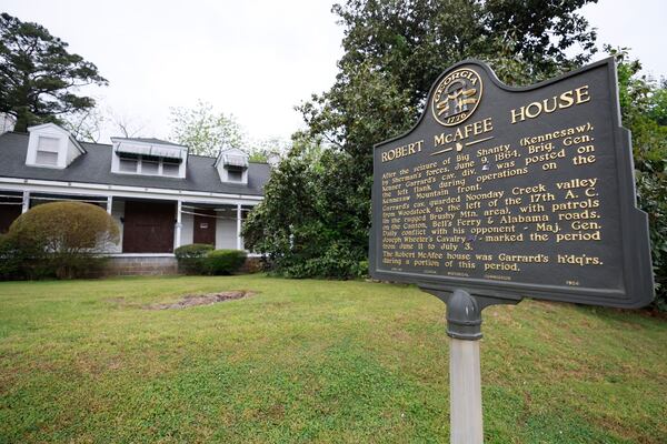 The sign on the side of the historic house shows part of what happened almost two centuries ago. The Eliza and Robert McAfee house in Marietta is in the midst of a dispute to find a solution for its fate.
Miguel Martinez /miguel.martinezjimenez@ajc.com