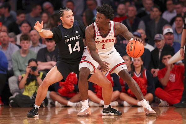 St. John's guard Kadary Richmond (1) works the ball against Butler guard Landon Moore (14) during the second half of an NCAA college basketball game in the quarterfinals of the Big East Conference tournament, Thursday, March 13, 2025, in New York. (AP Photo/Pamela Smith)