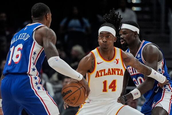 Philadelphia 76ers guard Lonnie Walker IV (16) drives against Atlanta Hawks guard Terance Mann (14) during the first half of an NBA basketball game, Monday, March 10, 2025, in Atlanta. (AP Photo/Mike Stewart)