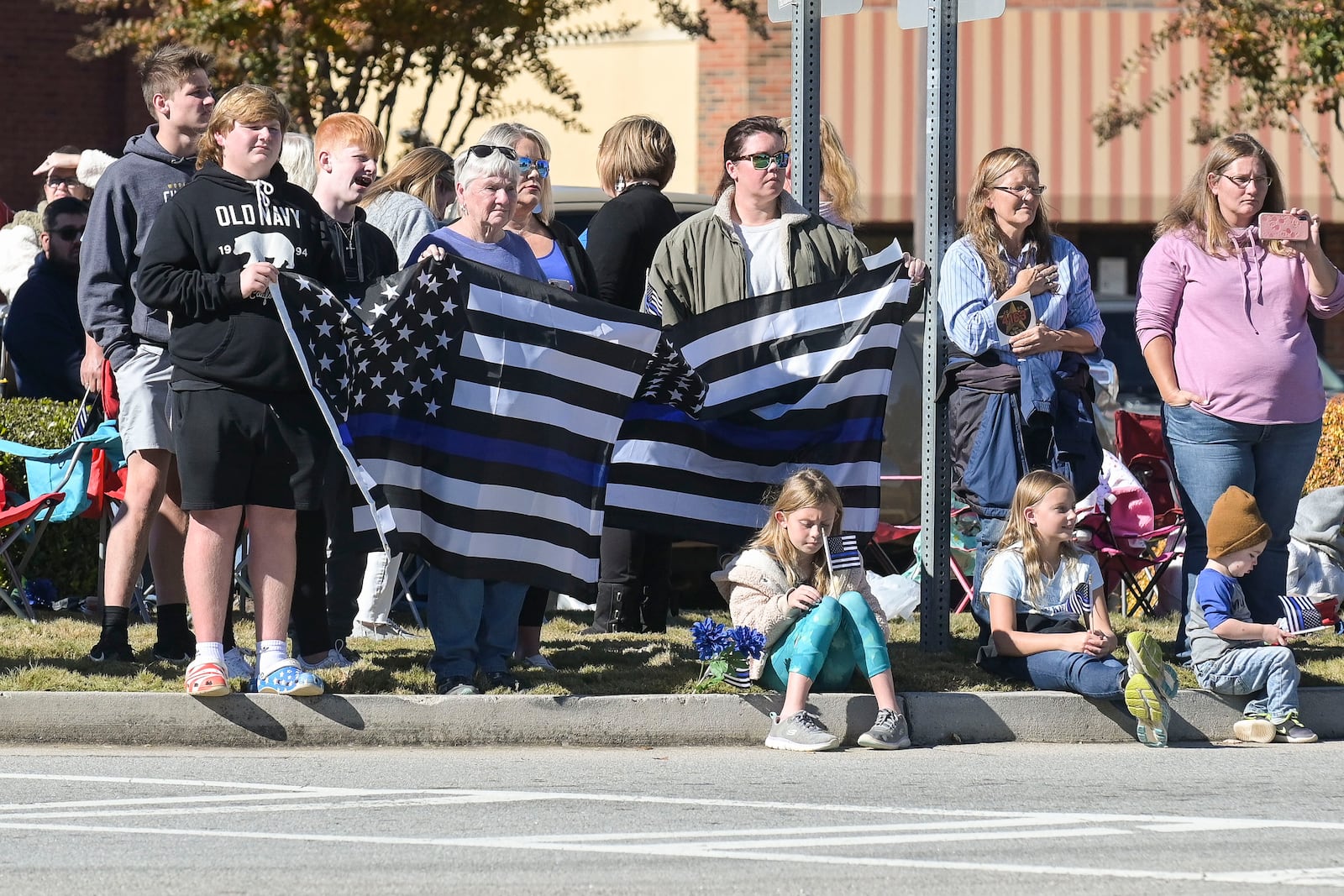 Area residents and officers pay their respects during a funeral procession for Jackson County Deputy Lena Marshall on Monday.