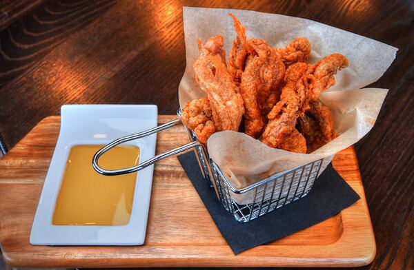 Crispy Chicken Skins, smoked honey.  (Contributed by Chris Hunt Photography)