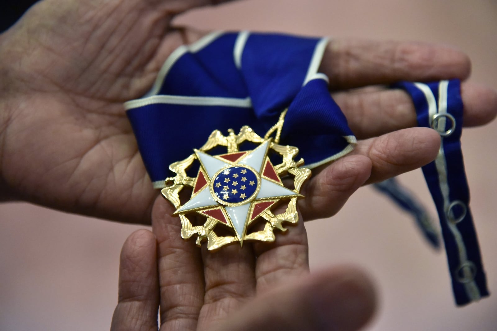 C.T. Vivian holds his Presidential Medal of Freedom on Tuesday, July 25, 2017. The National Monuments Foundation will be acquiring and managing the world-class library of Atlanta Civil Rights icon, C.T. Vivian. The library will be housed in the new Cook Park in Vine City. Vivian lived in the same Vine City neighborhood that will border Cook Park where his library is to be constructed under a 101-foot Peace Column. The 6,000 volume C.T. Vivian Library is one of the most impressive private collections in the city. HYOSUB SHIN / HSHIN@AJC.COM