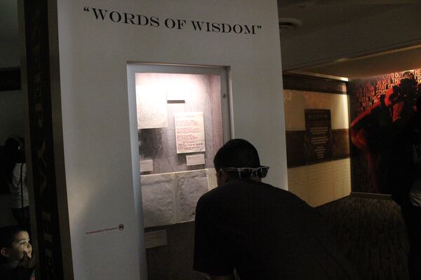 A fan checks out some of Shakur's writings in the museum. Photo: Melissa Ruggieri/AJC.