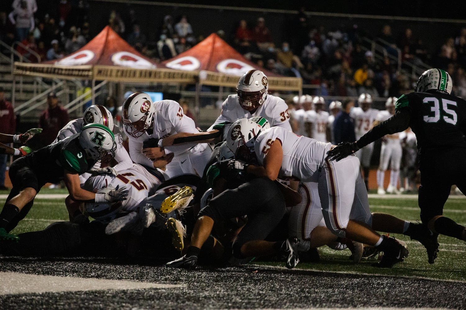 The Mill Creek offense pushes the ball into the endzone during the Mill Creek vs. Roswell high school football game on Friday, November 27, 2020, at Roswell High School in Roswell, Georgia. Mill Creek led Roswell 27-21 at the end of the third quarter. CHRISTINA MATACOTTA FOR THE ATLANTA JOURNAL-CONSTITUTION