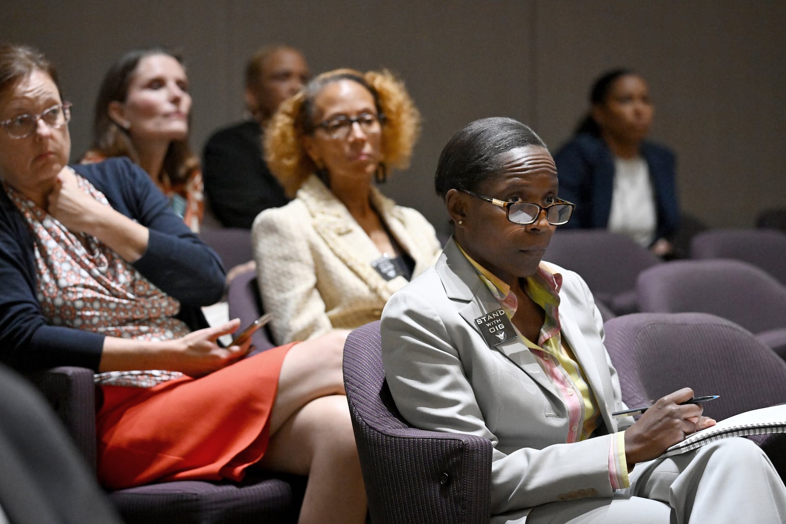 Inspector General Shannon Manigault sits among other attendees during the first meeting of a task force established to review the inspector general's authority at Atlanta City Hall, Tuesday, September 24, 2024, in Atlanta. The task force established to review the procedures of the Office of the Inspector General and Ethics Office met for the first time Tuesday. (Hyosub Shin / AJC)