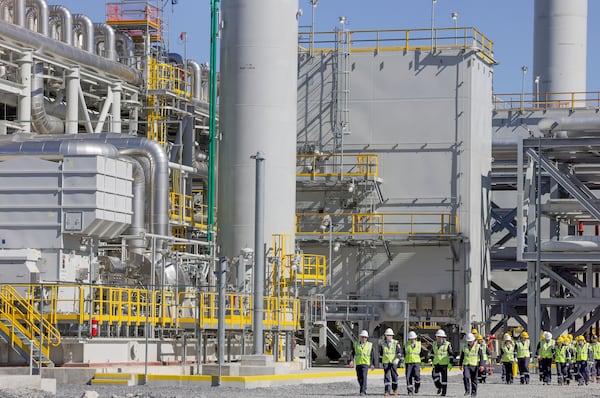 U.S. Secretary of Energy Chris Wright, Secretary of the Interior Doug Burgum and Louisiana Gov. Jeff Landry tour the Venture Global's Plaquemines LNG export facility Thursday, March 6, 2025, in Plaquemines, La. (Brett Duke/The Advocate via AP)