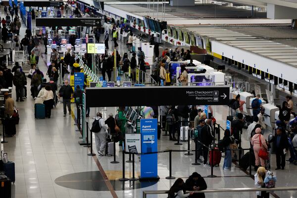 Passengers are going through ticketing lines at the North Terminal at the Hartsfield-Jackson Atlanta International Airport on Thursday, Dec. 22, 2022. During peak holiday travel times. , travelers may encounter long lines at airline ticket counters to check bags. Miguel Martinez / miguel.martinezjimenez@ajc.com