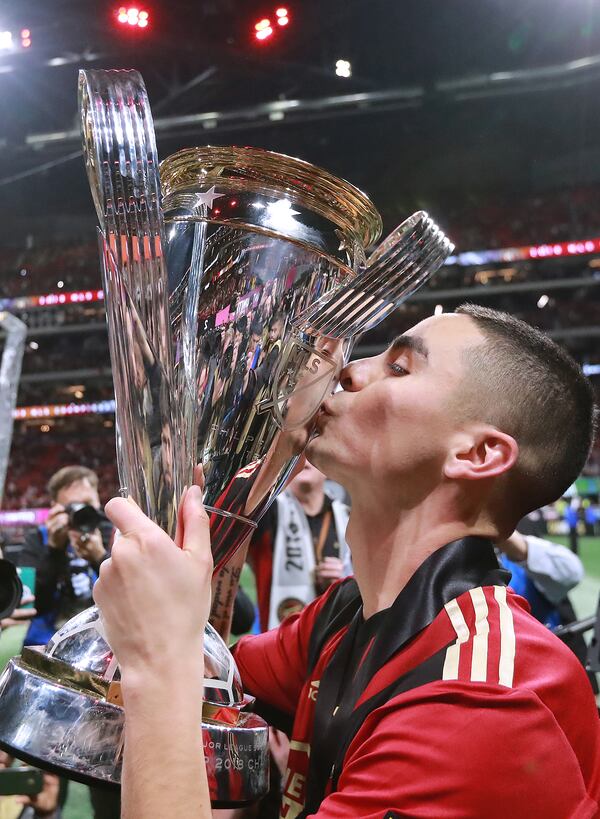 Atlanta United’s Miguel Almiron kisses the MLS Cup after a 2-0 victory over the Portland Timbers on Saturday, Dec 8, 2018, at Mercedes-Benz Stadium. (Photo: Curtis Compton/ccompton@ajc.com)