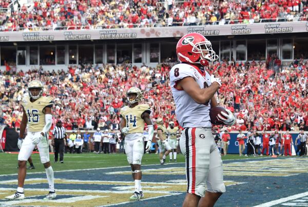 Georgia wide receiver Dominick Blaylock (8) celebrates after he scored a touchdown during the second half of an NCAA college football game at Bobby Dodd Stadium on Saturday, November 30, 2019. Georgia won 52-7 over the Georgia Tech. (Hyosub Shin / Hyosub.Shin@ajc.com)