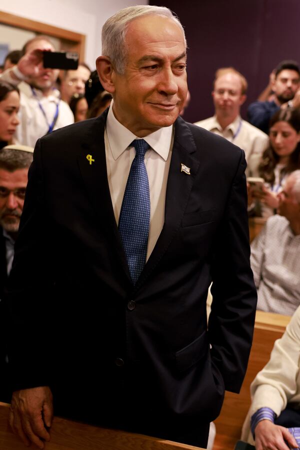 Israeli Prime Minister Benjamin Netanyahu arrives at the district court for his long-running trial for alleged corruption, in Tel Aviv, Israel, Tuesday, Dec. 10, 2024. (Menahem Kahana/Pool Photo via AP)