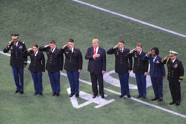 January 8, 2018 Atlanta - President Donald Trump attends during College Football Playoff National Championship at Mercedes-Benz Stadium on Monday, January 8, 2018. HYOSUB SHIN / HSHIN@AJC.COM