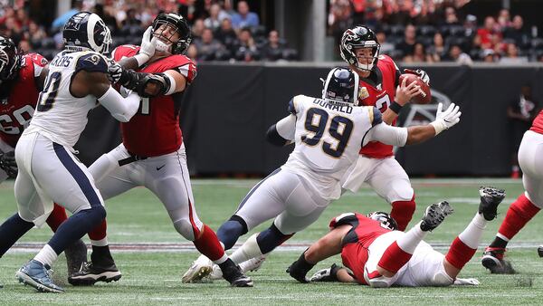 Los Angeles Rams defensive tackle Aaron Donald hits Falcons quarterback Matt Ryan causing a fumble that the Rams recovered and knocking Ryan out of the game with an apparent injury during the fourth quarter Sunday, Oct. 20, 2019, at Mercedes-Benz Stadium in Atlanta.