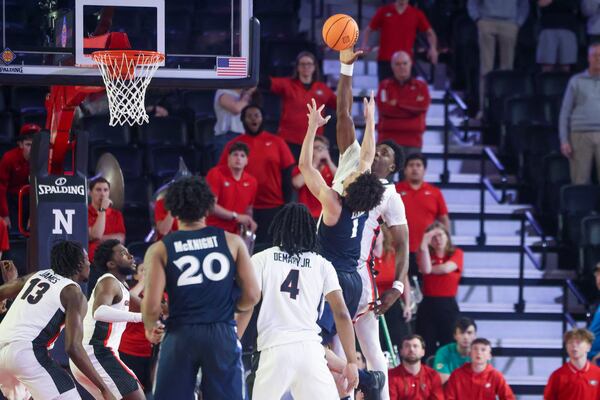 Georgia center Russel Tchewa (54) blocks the final shot by Xavier guard Desmond Claude (1) as time expires during Georgia’s 78-76 win in the first round of the NCAA’s NIT at Stegeman Coliseum, Tuesday, March 19, 2024, in Athens, Ga. (Jason Getz / jason.getz@ajc.com)