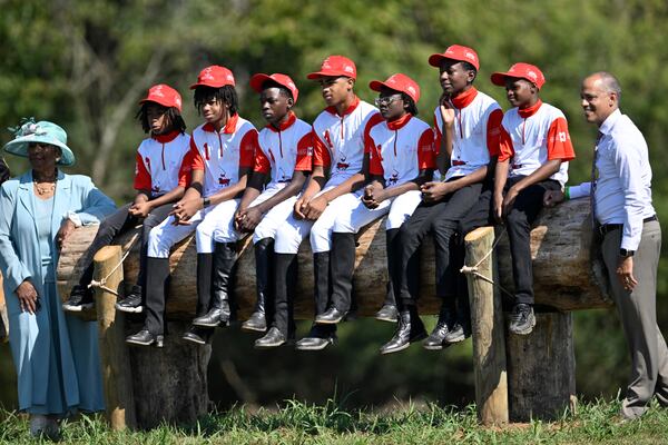 The B.E.S.T. Academy polo team, their parents, and the principal of the school, Robert Williams, pose for a group shot before their first-ever polo match on Oct. 13, 2024, in Fairburn, GA. (Jim Blackburn for the AJC)