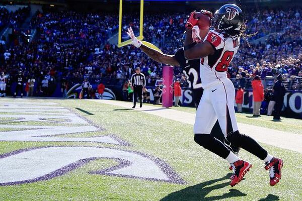 Wide receiver Roddy White #84 of the Atlanta Falcons catches a touchdown over defensive back Dominique Franks #32 of the Baltimore Ravens in the fourth quarter of a game at M&amp;T Bank Stadium on October 19, 2014 in Baltimore, Maryland. It was White's 58th career touchdown catch with the Falcons, a franchise record. (Photo by Rob Carr/Getty Images)