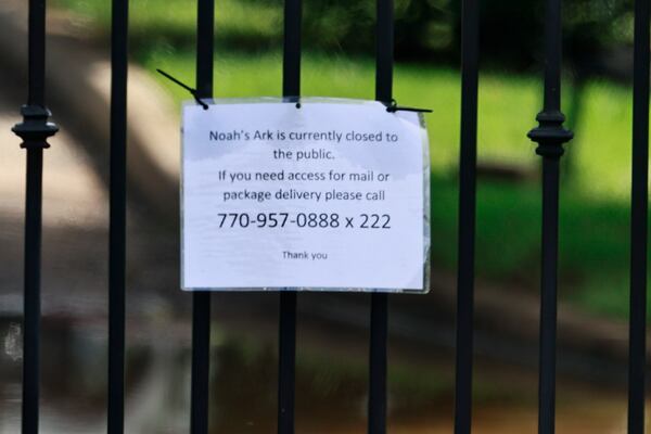 A “closed to the public” sign hangs on the gates of Noah’s Ark Animal Sanctuary in Locust Grove on Monday, August 22, 2022. (Natrice Miller/natrice.miller@ajc.com)