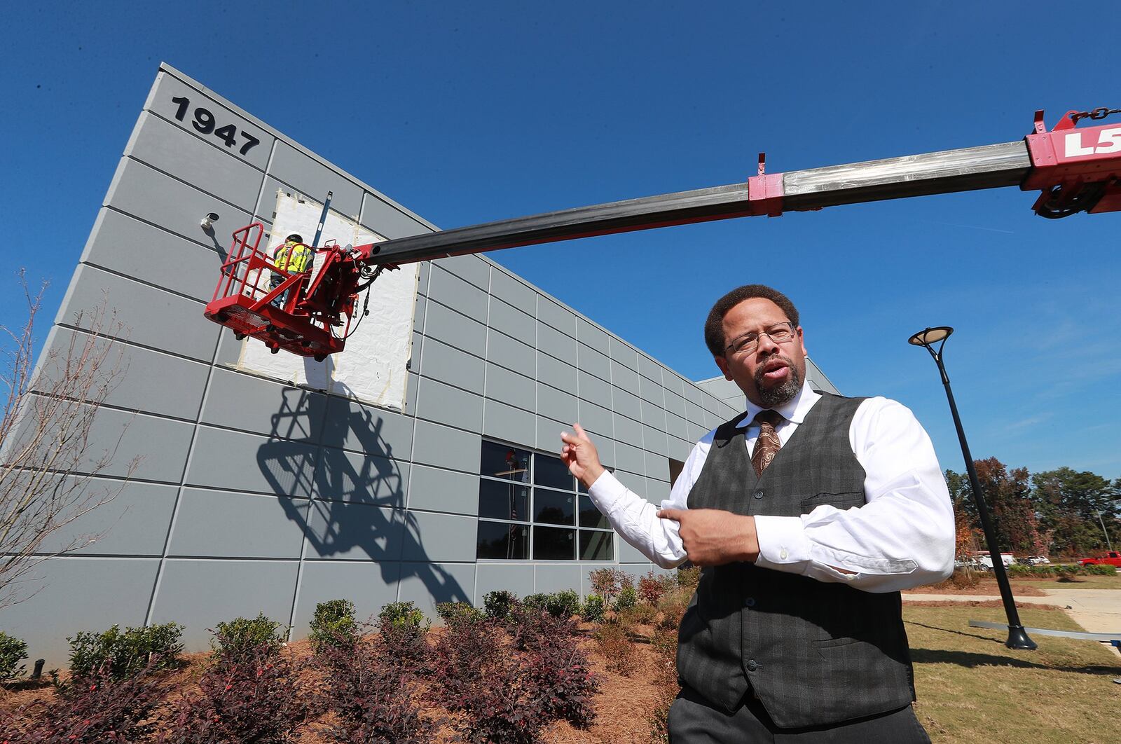 Khalfani Stephens, executive director of the Development Authority of Clayton County, gives a tour of the massive new LTI Inc., food service equipment manufacturer building on Tuesday in Jonesboro. The expansion of the longtime Clayton company is a win for the county’s economic development team. Curtis Compton/ccompton@ajc.com