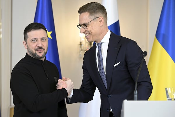 Finland's President Alexander Stubb, right and Ukrainian President Volodymyr Zelenskyy gesture at the end of a joint press conference, at the Presidential Palace, in Helsinki, Finland, Wednesday, March 19, 2025. (Heikki Saukkomaa/Lehtikuva via AP)