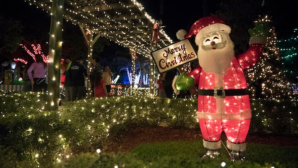 A Santa Claus welcomes visitors to Hoffman's Winter Wonderland in Greenacres. (Andres Leiva / The Palm Beach Post)