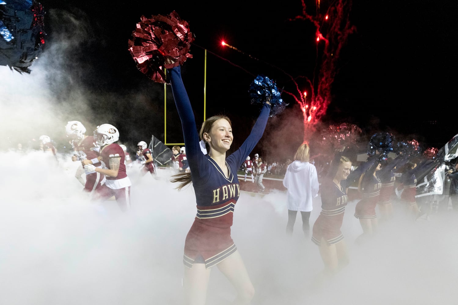 Mill Creek cheerleaders cheer before the game. (Photo/Jenn Finch, AJC)