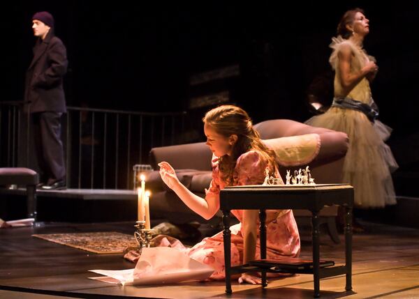 Joe Knezevich (as Tom Wingfield), Bethany Anne Lind (as Laura) and Mary Lynn Owen (as Amanda Wingfield) in Georgia Shakespeare's "The Glass Menagerie" in 2011.