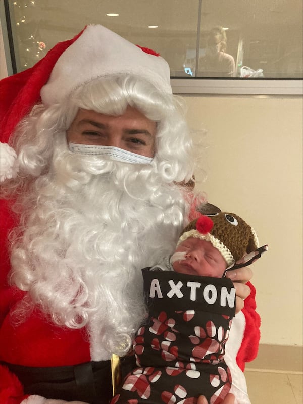 Baby Axton poses with Santa. 