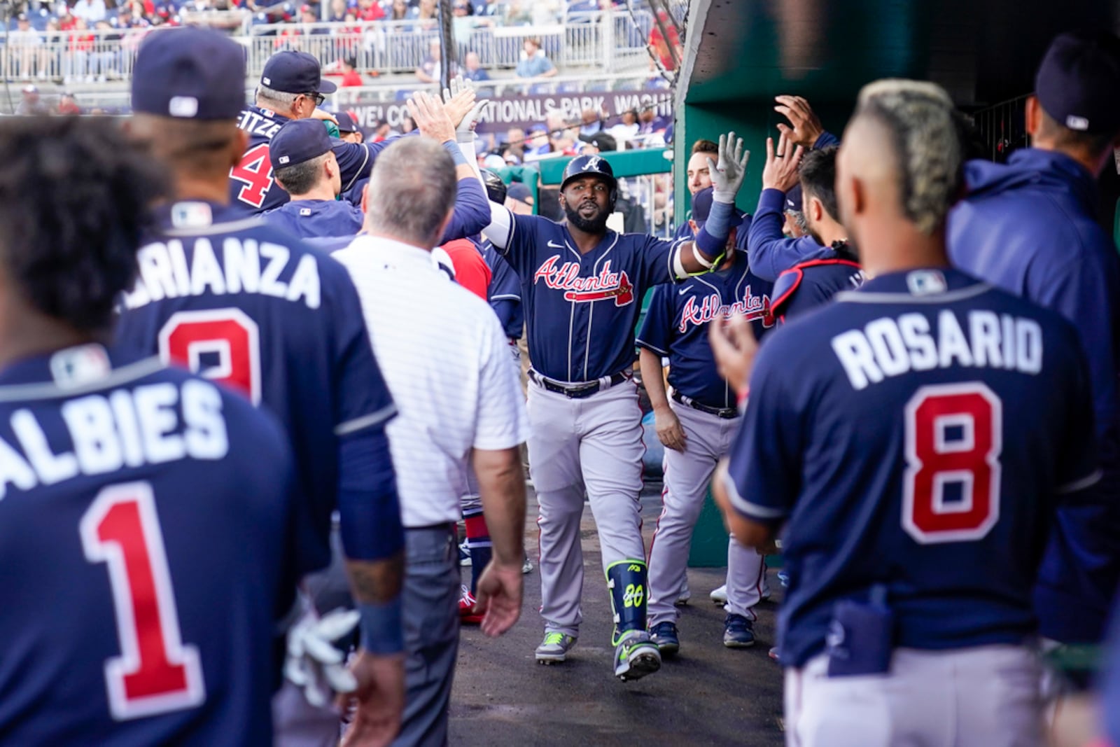 Braves designated hitter Marcell Ozuna, center, celebrates after his solo home run during the fourth inning of a baseball game against the Washington Nationals at Nationals Park, Saturday, April 1, 2023, in Washington. (AP Photo/Alex Brandon)