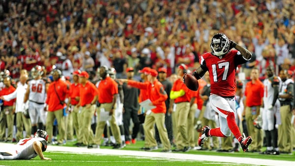 Devin Hester pays tribute to Deion Sanders as he avoids a tackle attempt by punter Michael Koenen on his way to returning a punt for a touchdown during a game Sept. 18, 2014, at the Georgia Dome in Atlanta.