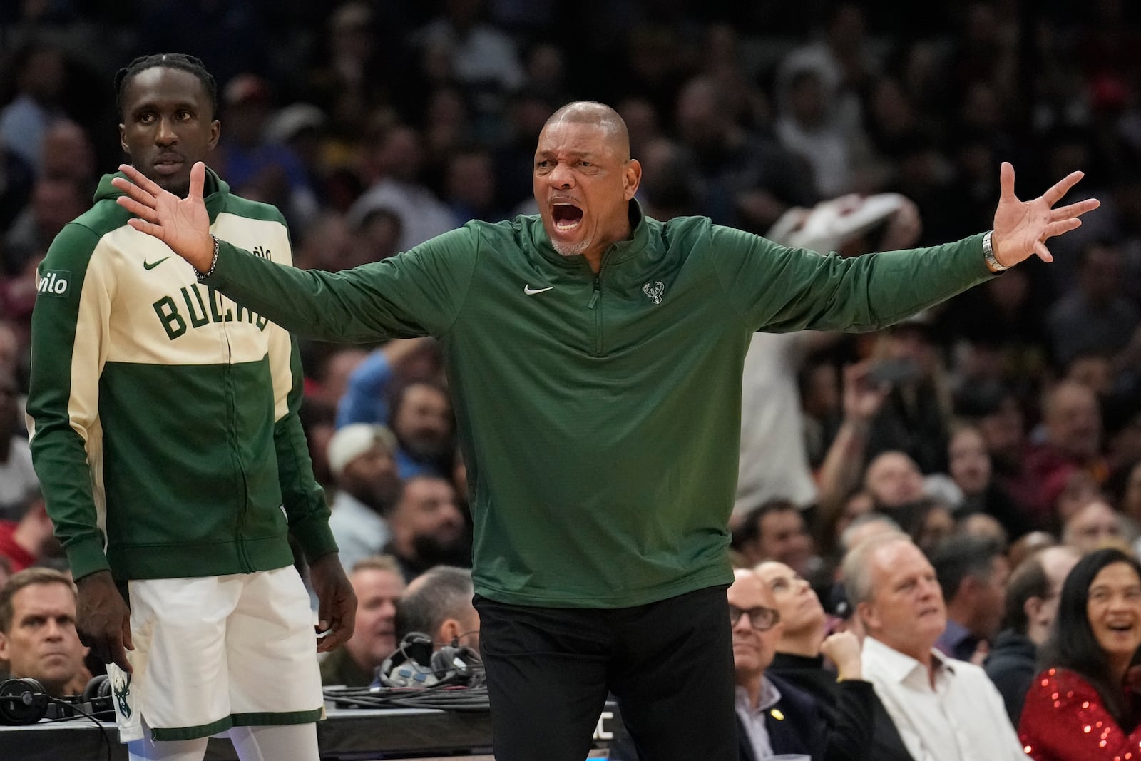 Milwaukee Bucks head coach Doc Rivers shouts to an official in the first half of an NBA basketball game against the Cleveland Cavaliers, Monday, Nov. 4, 2024, in Cleveland. (AP Photo/Sue Ogrocki)