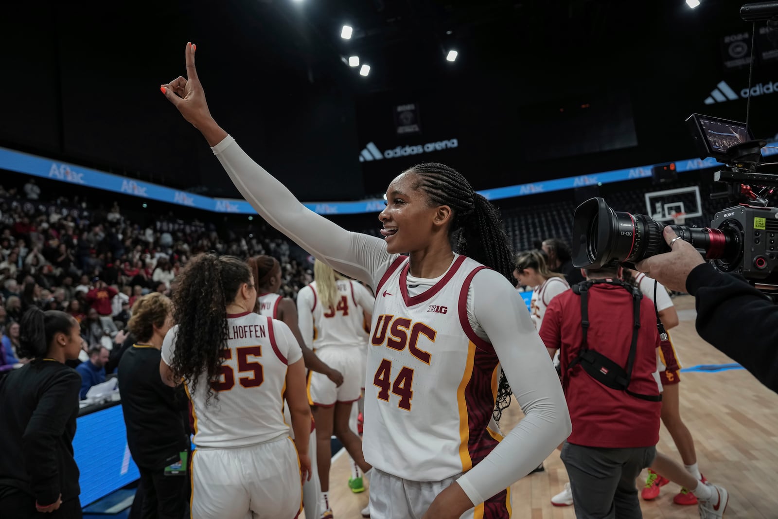 USC Trojans's forward Kiki Iriafen celebrates the victory during the basketball match between the University of Southern California (USC) and Ole Miss, Monday, Nov. 4, 2024 in Paris, France. (AP Photo/Aurelien Morissard)