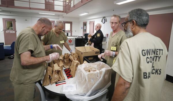 November 20, 2019 - Lawrenceville - Inmates in “The Barracks” prepare lunches for the unit. The Gwinnett County jail has designated a new housing unit just for inmates who are military veterans. “The Barracks” is intended to be a therapeutic, 70-bed unit focused on providing the type of support crucial to helping incarcerated veterans make a successful transition back into the community. Bob Andres / robert.andres@ajc.com