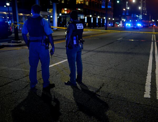 Atlanta police officers secure the scene after responding to a shooting on 17th Street near Atlantic Station on Saturday night. (Photo: Ben Hendren for The Atlanta Journal-Constitution)