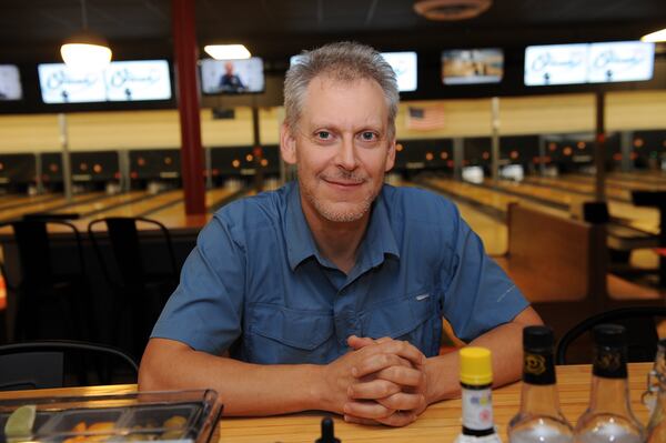 Ethan Wurzel at the bar at the Comet Pub & Lanes in Decatur. (BECKY STEIN PHOTOGRAPHY)