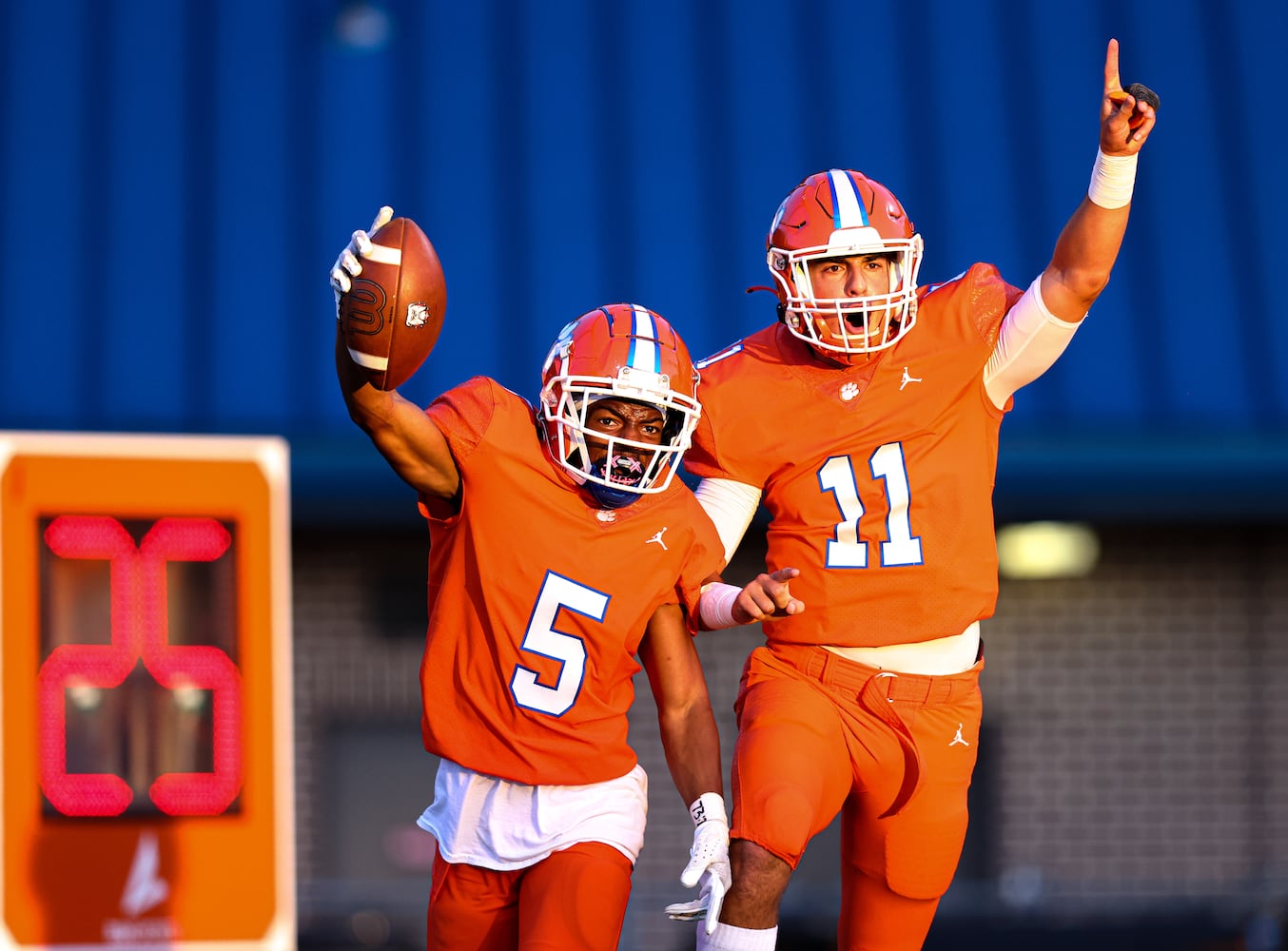 Parkview running back Donovan Paris (5) celebrates with Parkview quarterback Colin Houck (11) after a touchdown during a GHSA 7A high school football game between the North Gwinnett Bulldogs and the Parkview Panthers at Parkview High School in Lilburn, Ga., on Friday, Sept. 3, 2021. (Casey Sykes for The Atlanta Journal-Constitution)