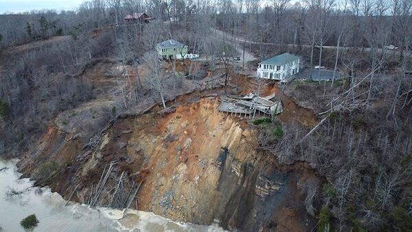 This drone photo provided by Hardin County Fire Department, Savannah, Tenn. on Feb. 15, 2030, shows the landslide on Chalk bluff on the Tennessee River.  Authorities say two homes were destroyed when a hillside collapsed near a swollen river in western Tennessee.