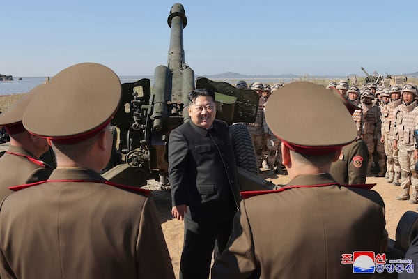 FILE- In this undated photo provided on Sunday, Oct. 6, 2024, by the North Korean government, North Korean leader Kim Jong Un, center, visits to watch an artillery exercise at an undisclosed place in North Korea. Independent journalists were not given access to cover the event depicted in this image distributed by the North Korean government. The content of this image is as provided and cannot be independently verified. Korean language watermark on image as provided by source reads: "KCNA" which is the abbreviation for Korean Central News Agency. (Korean Central News Agency/Korea News Service via AP, File)