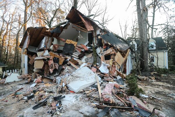 The tree fell across the front of the home on Old Ivy Road on Monday morning.