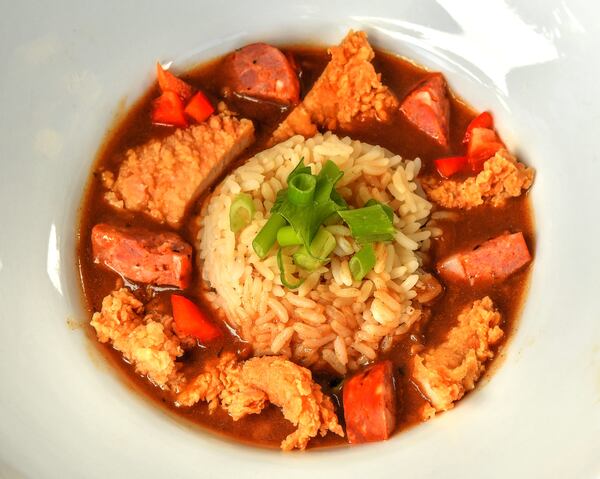 Chicken and Andouille Smoked Sausage Gumbo (shown in entree form), adapted from a recipe in “Chef Paul Prudhomme’s Louisiana Kitchen.” (Styling by Lisa Hanson / Chris Hunt for the AJC)