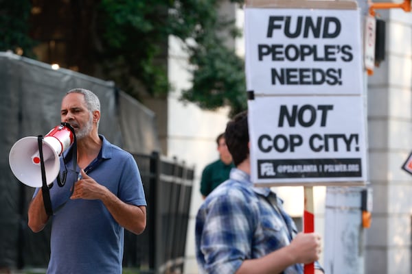 Community organizer Kamau Franklin speaks to demonstrators outside of the attorney general’s office in Downtown Atlanta on Friday, September 8, 2023. On Tuesday, Georgia Attorney General Chris Carr announced that a total of 61 training center activists have been charged with violating the state’s Racketeer Influenced and Corrupt Organizations act. (Natrice Miller/ Natrice.miller@ajc.com)