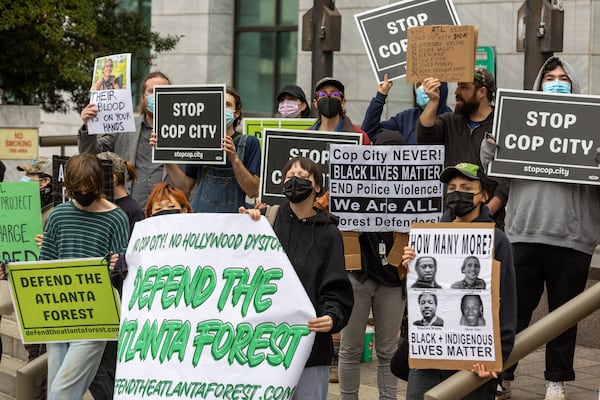 Demonstrators protest the construction of a new public safety training center during a press conference at City Hall in Atlanta on Tuesday, January 31, 2023. (Arvin Temkar / arvin.temkar@ajc.com)