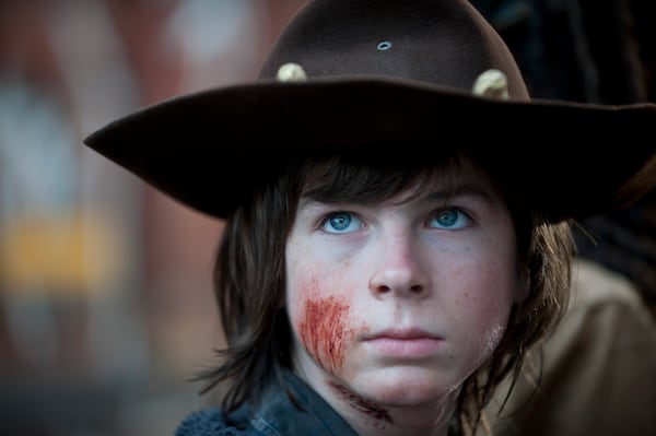 Carl Grimes (Chandler Riggs) - The Walking Dead _ Season 4, Episode 16 - Photo Credit: Gene Page/AMC Carl Grimes (Chandler Riggs) - The Walking Dead _ Season 4, Episode 16 - Photo Credit: Gene Page/AMC