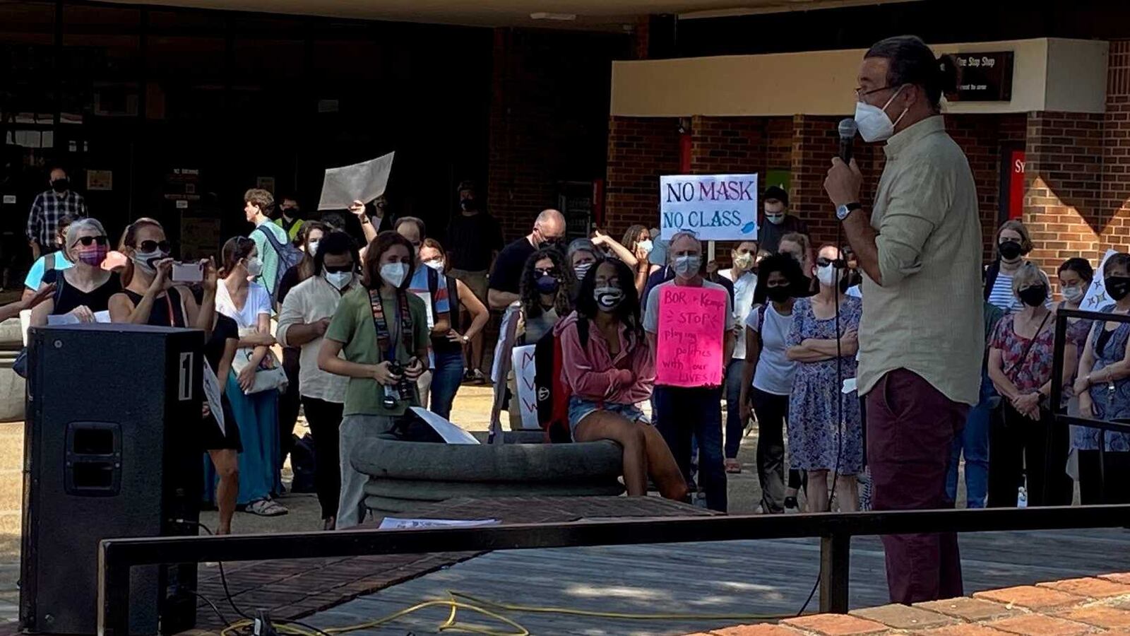 University of Georgia professor Joseph Fu speaks at a rally on campus on Sept. 14, 2021 demanding mask mandates and other measures to help mitigate the spread of COVID-19 at the university. Fu requires students to wear masks in his classes, which violates University System of Georgia policy. Employees are urging stricter COVID-19 measures as students are set to return to campus next week. ERIC STIRGUS/ERIC.STIRGUS@AJC.COM.