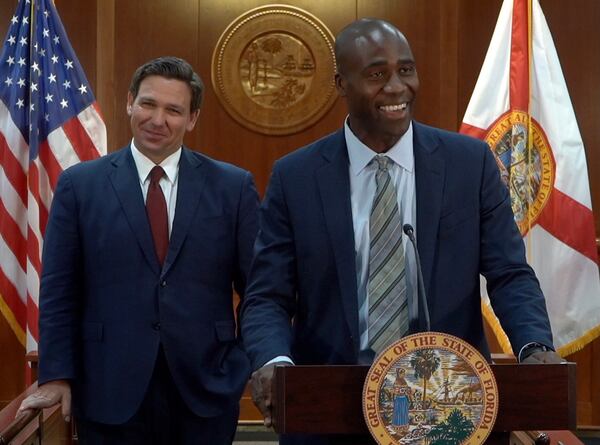 Florida state Sen. Tina Polsky told The Associated Press about the tense exchange with state Surgeon General Joseph Ladapo, right, that was first reported by the news site Florida Politics. She said Ladapo and two aides were offered masks and asked to wear them when they arrived for the Wednesday meeting. She did not tell him she had breast cancer but said she had a serious condition. (Governor's Office photo/TNS)