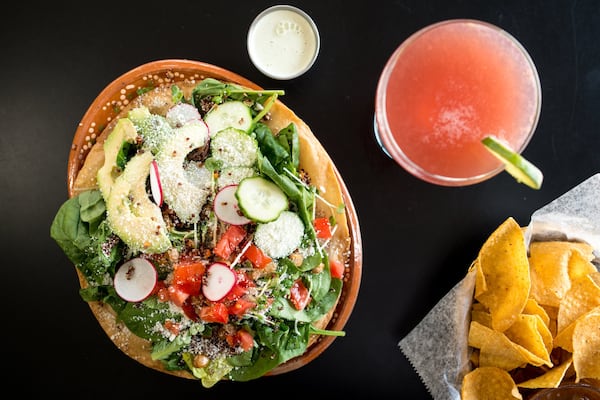  Mexicola Super Grains salad with quinoa, black beans, garbanzo beans, cucumber, avocado, tomato, greens and kale, and queso cojita on a crispy flour tortilla. Photo credit- Mia Yakel.