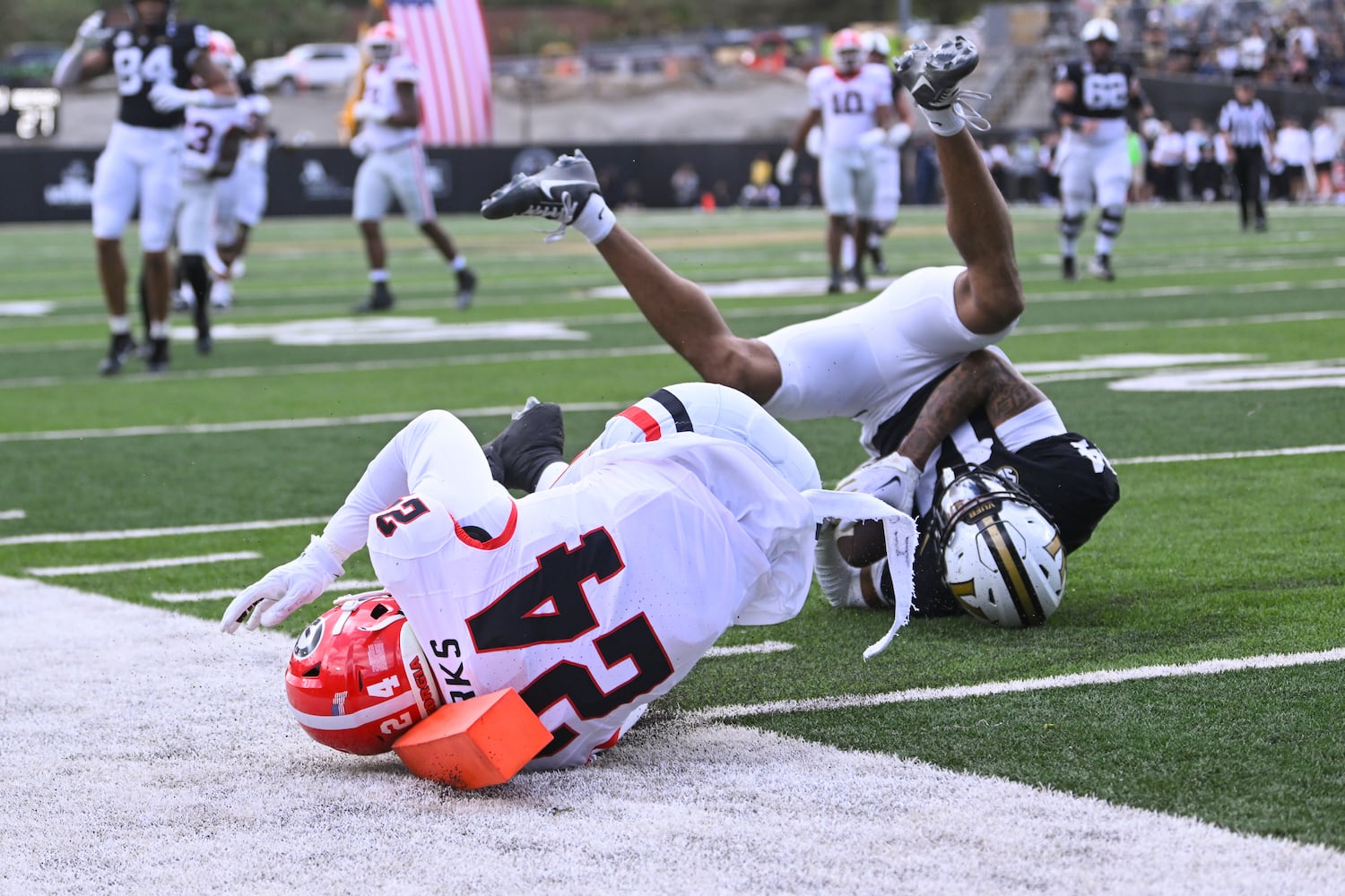 Georgia defensive back Malaki Starks (24) stops Vanderbilt wide receiver Will Sheppard (14) from scoring during the second half of an NCAA football game against Vanderbilt, Saturday, Oct. 14, 2023, in Nashville, Tenn. Georgia won 37-20. (Special to the AJC/John Amis)