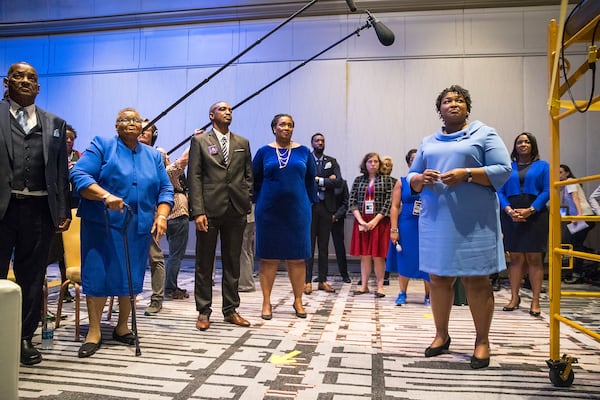 11/07/2018 -- Atlanta, Georgia -- Georgia gubernatorial candidate Stacey Abrams (right) waits backstage with her family and friends before speaking to a crowd of supporters during her election night watch party at the Hyatt Regency in Atlanta, Wednesday, November 7, 2018. Georgia's gubernatorial race was too close to call, possibly signaling a run-off election. (ALYSSA POINTER/ALYSSA.POINTER@AJC.COM)